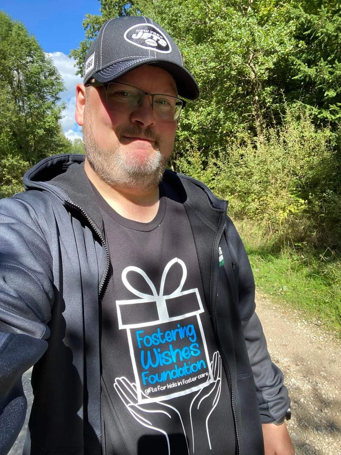 A young supporter in a Fostering Wishes tee