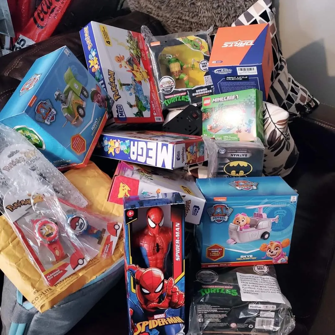 Boxed toys and games sorted and ready to be wrapped as holiday wishes